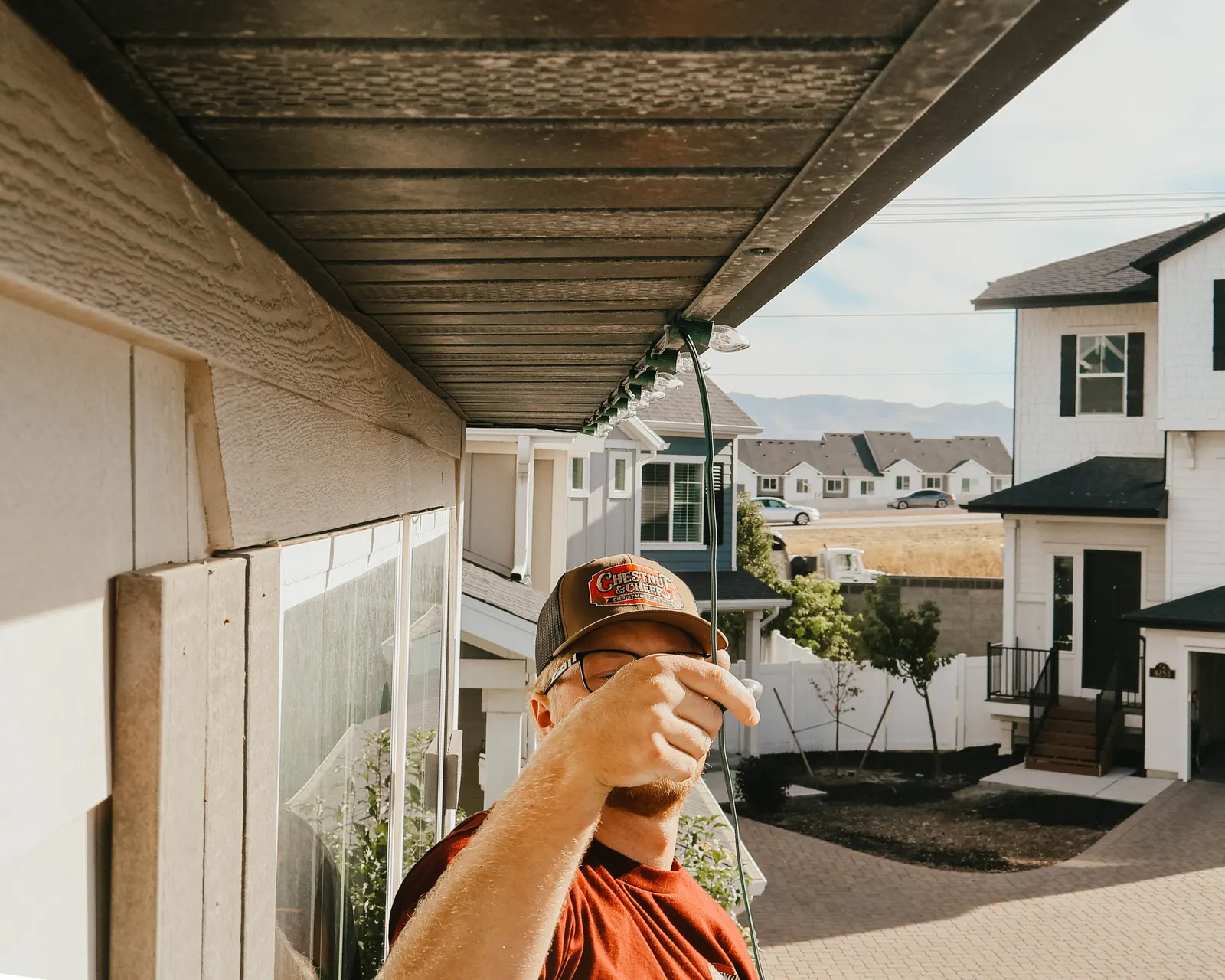 Close-up of professional Christmas light clips secured beneath a Utah home roofline